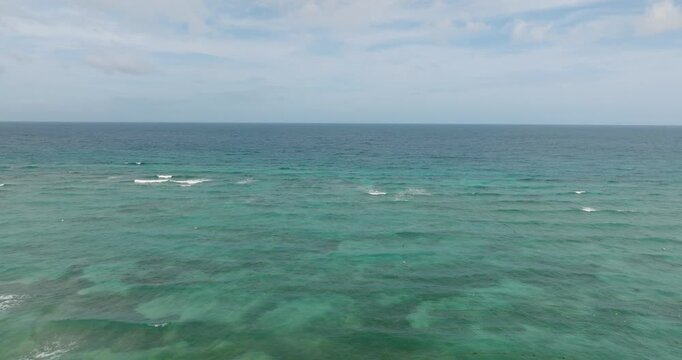 Ocean waves and corals reefs with turquoise water. Blue sea in Santa Fe, Tablas, Romblon. Philippines.