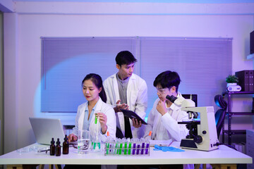 A team of scientists collaborating over data charts and lab results, Dedicated scientists collaborating on groundbreaking research in a modern laboratory environment