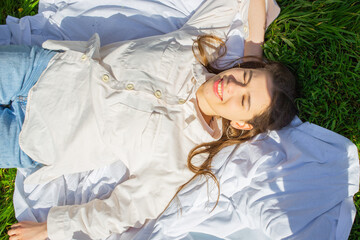 Woman relaxing on a picnic blanket,