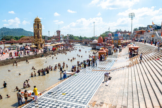 people is doing purification ceremony in ganges river at haridwar	