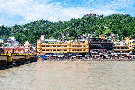 people is doing purification ceremony in ganges river at haridwar	