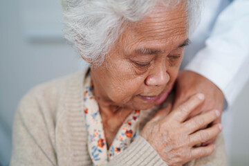 Doctor holding hands Asian elderly woman patient, help and care in hospital.