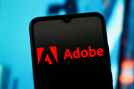 In this photo illustration, the Adobe logo is seen displayed on a smartphone screen.