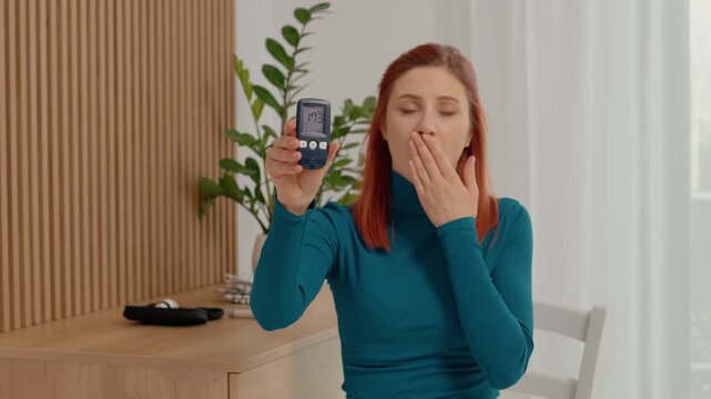 A woman displays her glucometer reading of 173 mg dL with a shocked expression. She is in her home, addressing the camera while concerned about her health.