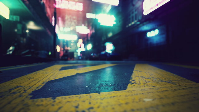 An urban alleyway glows with colorful neon signs shining against the dark night. The wet pavement reflects the vibrant lights, creating a lively atmosphere full of energy and mystery.