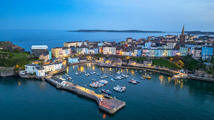Fototapeta premium Tenby Harbour at blue hour with harbour lights, Pembrokeshire, Wales