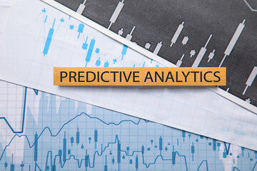 Predictive Analytics text with a financial graphs.