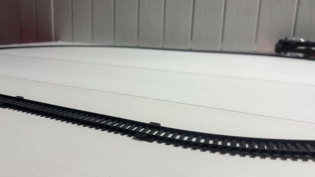 Toy Train Moving Through Colorful Track with Blocks and Play Structures