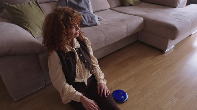 Nostalgic woman listening to music on a vintage cd player
