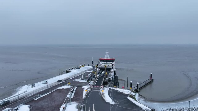 Ferry disembarking at a coastal harbor
