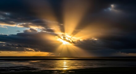Dramatic sunset over serene water with sun rays piercing through dark clouds
