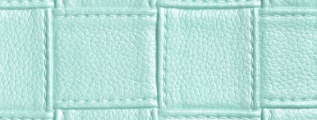 Fototapeta premium Texture light mint leather background with quilted stitched pattern, macro. Abstract pastel upholstery surface