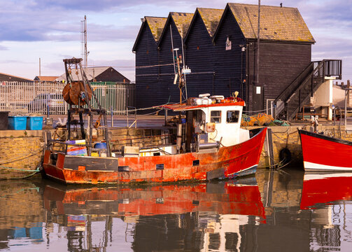 Whitstable Harbour in the morning with docked boats