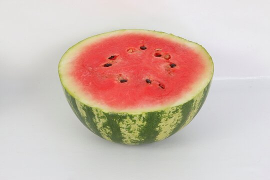close up of a half watermelon on white ground