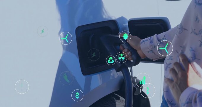 Animation of eco icons over african american man charging electric car