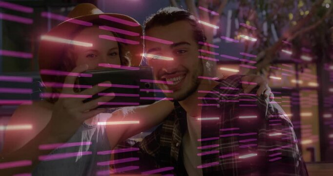 Taking selfie with friends, vibrant pink light patterns overlaying them