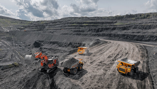 Aerial view banner Open pit mine industry, excavator and big yellow mining truck for coal anthracite