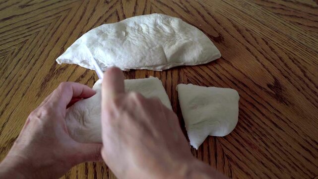 Make Adjarian Khachapuri: Step by Step Guide signature Georgian dish shaped like a boat, filled with melted cheese and topped with a raw egg embodies the rich culinary. Cut the dough into three pieces