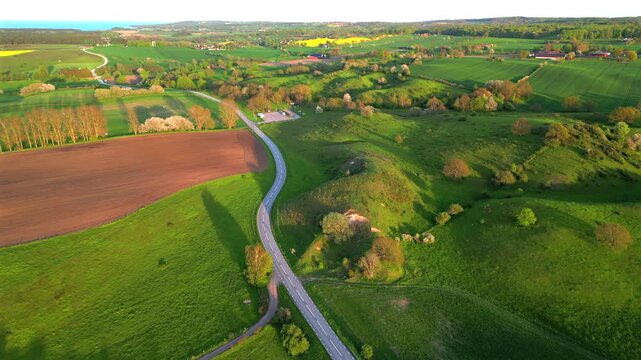 Aerial view of Osterlen rolling hills during sunset Sweden