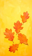 Fototapeta premium Five vibrant oak leaves with fall hues against a textured, solid yellow artistic background