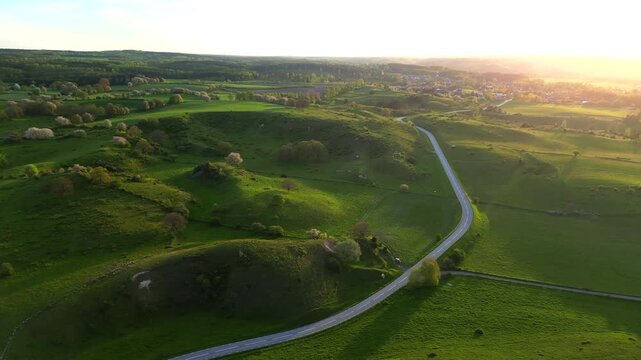 Aerial view of Brosarp rolling hills during sunset Sweden