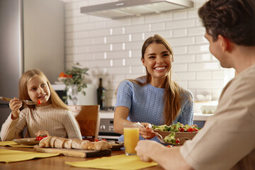 Happy Family Eating Healthy Meal Together in Cozy Kitchen