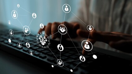 Digital networking concept with hands typing on keyboard, connecting various icons representing people in social media and online communication in modern workspace Gluon.