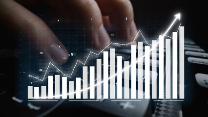 A close-up image of a hand on a keyboard with an overlay of a digital graph and a bar chart, illustrating financial growth and data analysis in a modern business setting. Copula