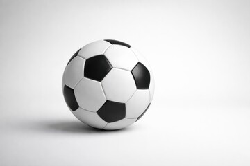 Naklejka premium Classic Black and White Soccer Ball on Studio Background