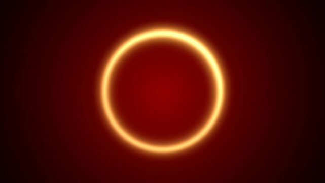 Solar eclipse with vibrant orange glow on dark background