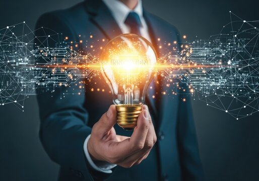 A businessman in a suit holds a glowing incandescent light bulb, symbolizing innovation, ideas, and technological advancement with digital network connections - Powered by Adobe