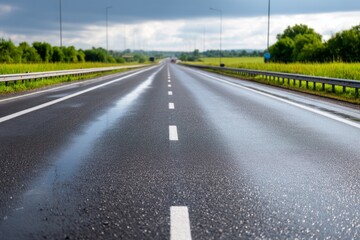 Fototapeta premium Long Highway Scene After Heavy Rain with Reflective Asphalt Surfaces