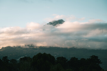 Fototapeta premium Cloud Wrapped Mountain at Sunrise