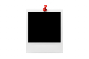 A blank polaroid-style instant photo frame pinned to a black surface with a red thumbtack isolated on transparent background