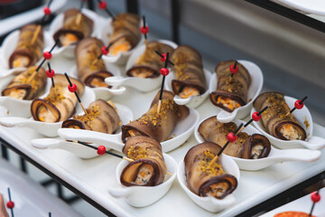 Decorated catering table buffet, banquet with variety of different gourmet exquisite food snacks...