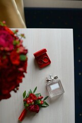 wedding accessories. perfume boutonniere and rings