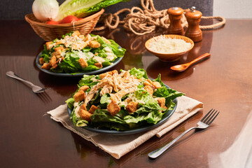 Caesar salad with shredded chicken, croutons and parmesan