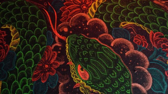 painting of the year of the snake with acrylic paints on fabric