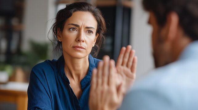 Faceless woman saying no to attention and gifts from man pursuing her girl demanding to be left alone by guy flirting rejection moment unwanted advances boundary setting with