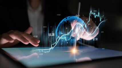 A business professional conducts financial analysis on a tablet, showcasing a digital globe and graphs that depict market trends and economic data in a sleek modern setting. Scalp