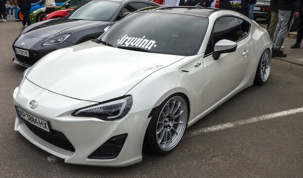 White Scion FR-S is a lightweight, rear wheel drive sports car, was designed to prioritize mechanical balance and driver engagement over raw power
