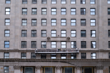 Fototapeta premium Building facade with window washing scaffold