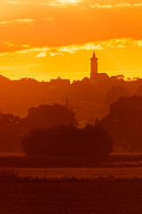 Megazoom (600mm) summer sunset or sundowner with a church silhouette near Toeding, Thuernthenning, Moosthenning, Dingolfing, Landau, Bavaria, Germany