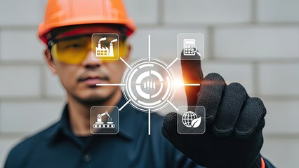 Construction worker in safety gear interacting with a holographic interface featuring icons for manufacturing, data analytics and sustainability, symbolizing smart industry operations and environment