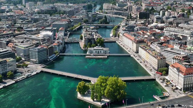Aerial drone view of Geneva city featuring Lake Geneva, city skyline, and surrounding urban landscape in Switzerland.