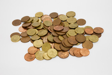 Creative Savings Concept: Coins and Metal Hardware in Glass Jar on Minimal White Background
