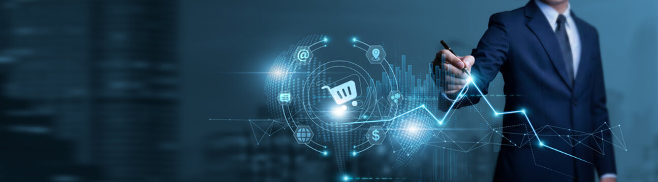 Businessman touches e-commerce data chart with pen and performs analysis on online sales trends, marketplace performance, digital storefronts, and customer behavior.