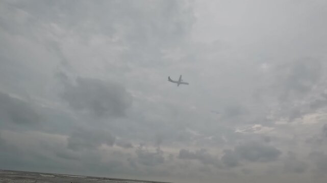 Aircraft Landing at Cox&rsquo;s Bazar near Sea Beach. An aircraft approaches landing at Cox&rsquo;s Bazar Airport with the vast sea beach nearby, creating a rare and breathtaking scene. 