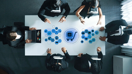 Aerial view of business professionals engaged in a virtual reality meeting focused on artificial intelligence and e-commerce concepts in a modern office setting. Trope
