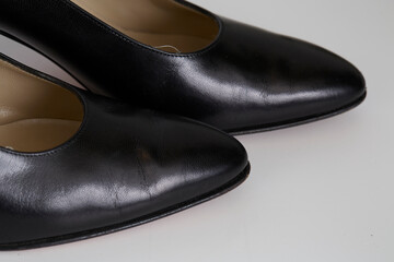 Metallic and leather shoe on a white background